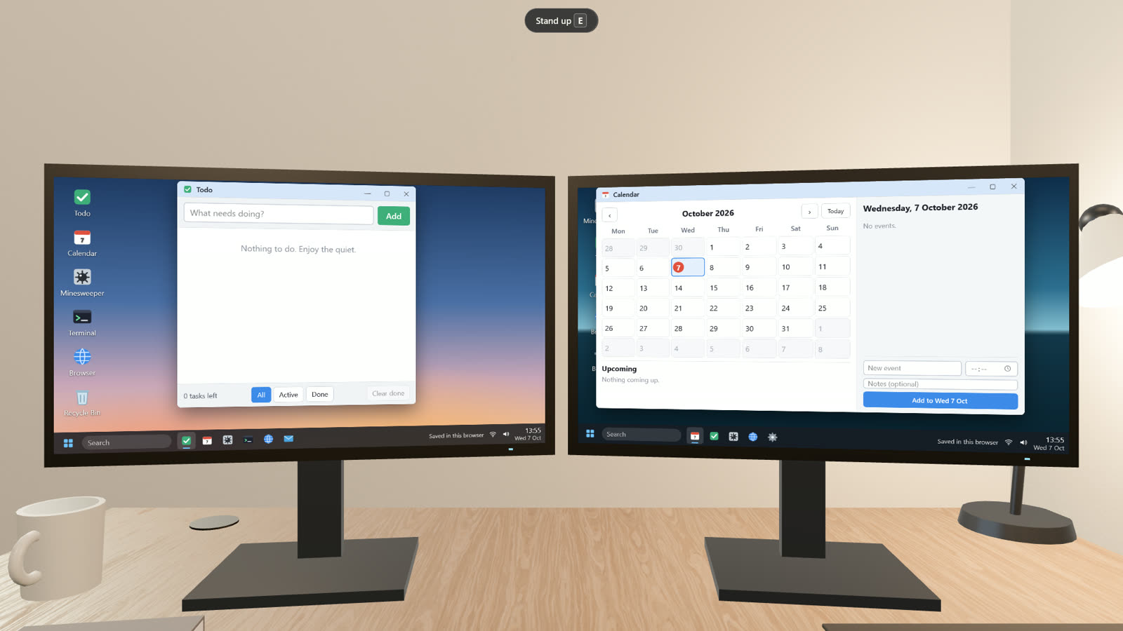 At home, the two-monitor desk runs live desktop apps.